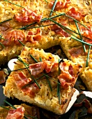 Close-up of onion tart with bacon and chives