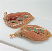 Pheasant breast stuffed with parma ham and sage on chopping board, step 2
