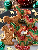 Gingerbread in the form of rocking horse with colourful icing sugar and sugar pearls