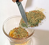 Spices added to mixture in bowl, step 1