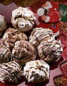 Close-up of almond meringues with chocolate strips and chocolate powder
