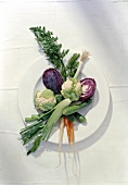 Cauliflower, zucchini and carrots on plate, overhead view