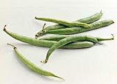 Long green beans on white background
