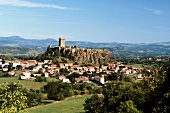 View of town and Chateau de Polignac castle in Polignac, Auvergne, France