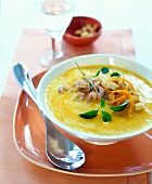 Close-up of pumpkin and orange soup in bowl