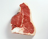 Raw beef meat from porterhouse steak on white background