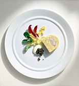 Artichoke mousse with lobster on white plate, overhead view