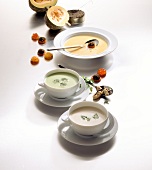 Soups of pumpkin, caviar and caviar croutons in bowls on white background