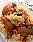 Close-up of Alsatian style goose with sauerkraut and bacon