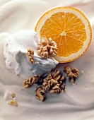 Close-up of yogurt sauce with orange and walnuts