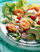 Close-up of iceberg lettuce with shrimps and avocados