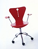 Red office chair against white background