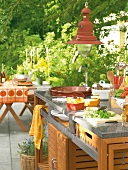 Outdoor kitchen counter made of stainless steel, granite and teak wood