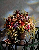Close-up of dried roses and wild flower bouquet in vase