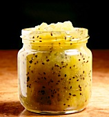 Pineapple and kiwi yellow jam with mint in glass jar