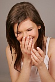 Happy Magdalena woman with brown hair having wet face and hands, laughing