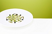 Grid of white and green asparagus on plate