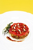 Tomato tart on white plate