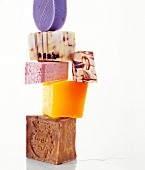 Close-up of stacked soap bars on white background