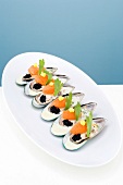 New Zealand mussels with brandade, herring caviar and saffron rouille on plate