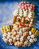 Various types of biscuit arranged in form of Santa Claus head, overhead view