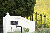 Entrance gate and company logo of Winery Ken Forrester, South Africa