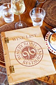 Wine glasses and book with wine list for restaurant, Winery Ken Forrester, South Africa