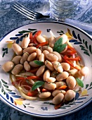 Bean salad with peppers and sage on plate