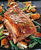 Golden brown roast pork belly with spring onions and garlic