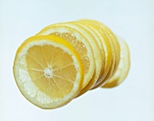 Slices of lemon against white background