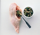 Chicken being filled with lobe fungal herbal mix