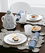 Table covered with sweater-knit accessories in gray