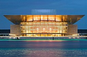 View of illuminated Royal Opera at night in Copenhagen, Denmark