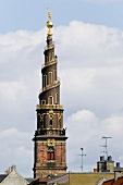 View of Church of Our Saviour between rooftops in Christianshavn, Copenhagen, Denmark
