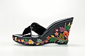 Black wedge heel with embroidery on white background