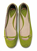 Green ballerina shoes on white background