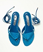 Blue toe sandals on white background