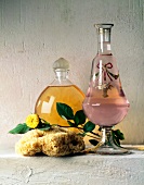 Glass bottle, Carafe, Sponge and yellow rose kept against white background