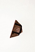 Close-up of chocolate piece on white background