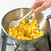Adding powder to pumpkins in bowl, step 1
