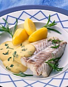 Cod fillet with mustard sauce, tarragon and potatoes in serving dish