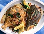Finkenwerder plaice style with pieces of bacon and lemon in serving dish
