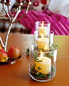 Close-up of three lanterns with burning candles