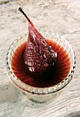 Dried pear with red wine in bowl
