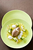 Chilli chocolate ice with avocado, rum foam and pineapple carpaccio served on plate