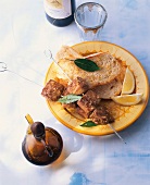 Meat skewers with bread and lemon on plate, Spain
