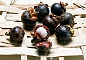 Peeled mangosteen on weaved bamboo sheet