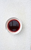 Blood in bowl on white background