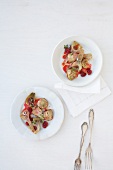 Artichoke salad with raspberry vinaigrette on two plates