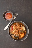 Lamb curry with sweet potatoes and eggplant in pot